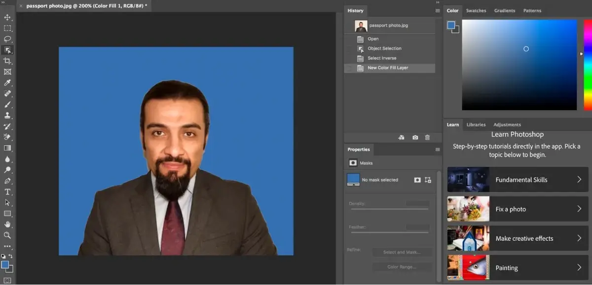 Cropping a passport photo with blue background at Photoshop